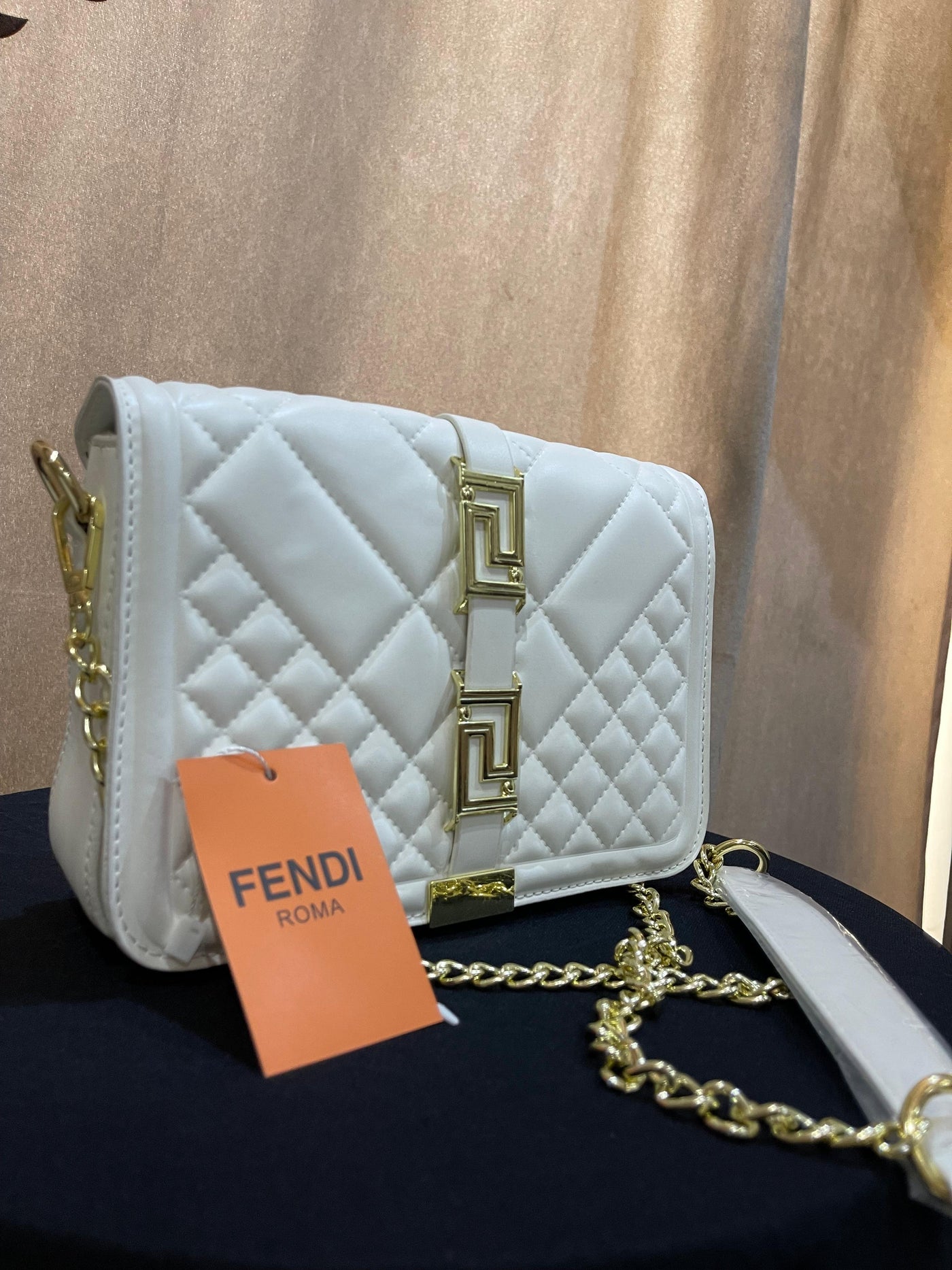 white hand bag